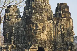 Giant faces carved in stone above the south entrance of Angkor Thom