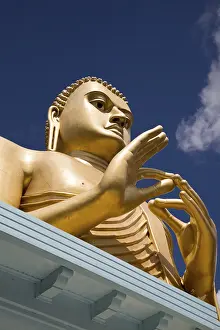 Giant Golden Buddha statue at Dambulla cave temple complex