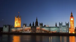 A giant image of US American swimmer Michael Phelps is projected onto the facade of the Houses of Parliament for
