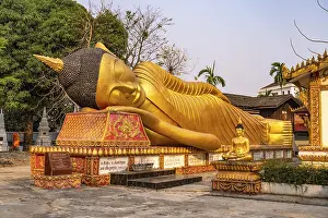 Giant reclining Buddha at Wat That Khao temple in the capital Vientiane