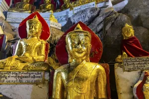 Gilded buddha images in the caves at Pindaya