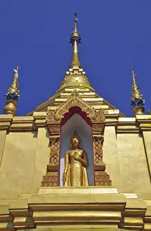 Gilded Buddha making hand gesture