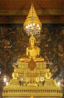 Gilded Buddha statue at the Phra Ubosot ordination hall