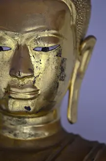 Gilded Buddha statue in Wat Pho