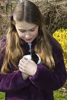 Girl, 10 years old, with a pet rabbit