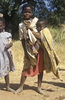Girl carrying a toddler, Bwangu Mzimba