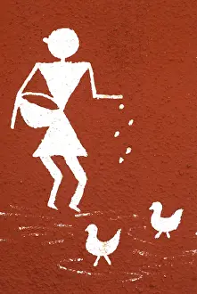 Girl feeding cock, Warli painting on wall