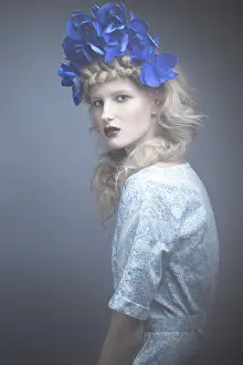 Girl with flowers on her head in a dress in the Russian style
