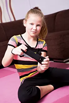 Girl playing with game console