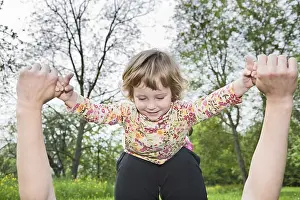 Girl playing with her mother, "One