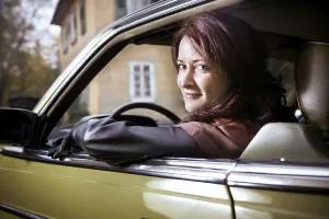 Girl in front of Post-War classic car