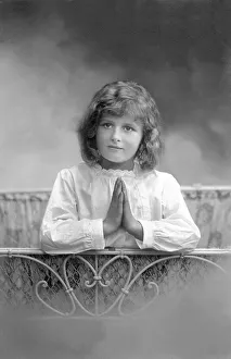 Girl praying, historical image, ca. 1912