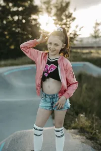 Girl with roller skates on a skating rink