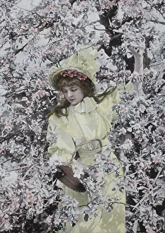 Girl standing under a tree in full bloom