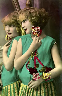 Girl stands in front of a mirror