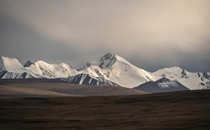 Glaciated and snow-capped mountains in the evening light