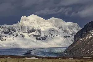 Glacier, glacier tongue, steep snow-covered mountains