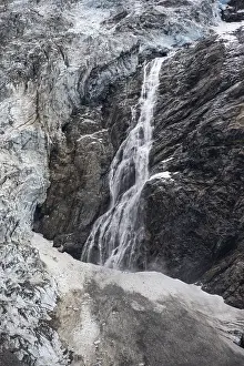 Glacier tongue and waterfall, mountain landscape
