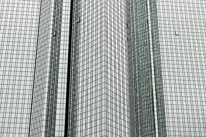Glass-mirrored exterior facade of the main building or headquarters of Deutsche Bank in Frankfurt am Main