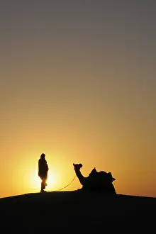 Category Historic EN Prints: Glorious sunrise man with camel on sand dunes
