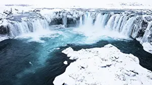 Godafoss waterfall, snowy landscape