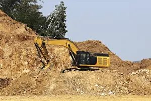 Gold mine excavator is seen in an opencast quarry