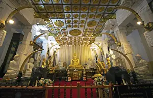 Golden Buddha figure in the Buddhist Temple of the Tooth or Sri Dalada Maligawa