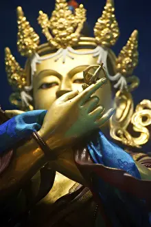 Golden Buddha sculpture in Tibetan Monastery
