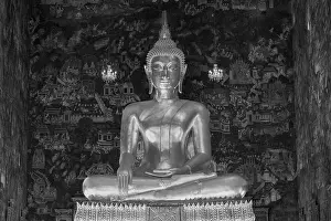 Golden Buddha statue, Phra Buddha Trilokachet surrounded by crystal chandeliers and exquisite wall paintings