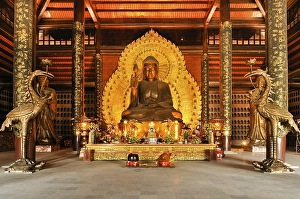 Golden Buddha statue at the construction site of the Chua Bai Dinh pagoda