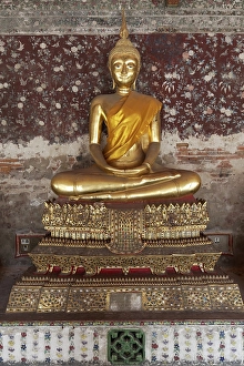 Golden Buddha statue in meditation posture