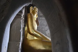 Golden Buddha statue, seated Buddha at a pagoda