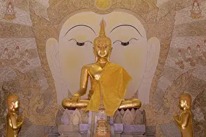 Golden Buddha statue with tunic
