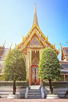 Golden entrance to the beautiful Buddhist temple in Bangkok