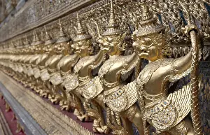Golden figures warrior in royal palace stand in row