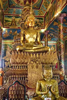 The golden interiors of the Wat Phnom Temple in Phnom Penh
