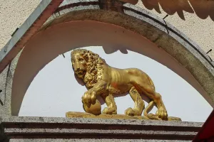 Golden lion, figure on facade