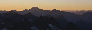 Golden morning light over rugged Swiss mountains