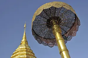 Golden pagoda (chedi) and golden umbrella (symbol of luck and power)