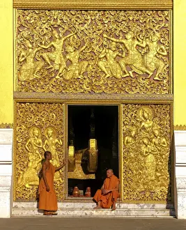 Golden reliefs, monks at the entrance to the Carriage House