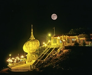 Category Buddhism Prints: Golden Rock or Kyaiktiyo Pagoda illuminated at night with a full moon