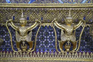 Golden sculptures of Garuda and Naga