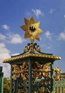 Golden star with black eagle on the fence of Charlottenburg Palace