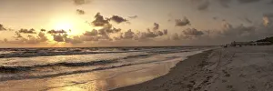 Golden sunset over the white sand of Clam Pass Beach to the ocean in Naples