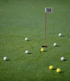 Golf ball on the green, golf balls on hole 14