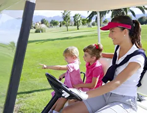 Category Historic EN Prints: Golf course family mother and daughters in buggy green grass field