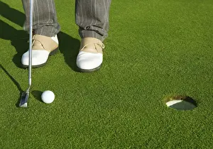 Category Historic EN Prints: Golf green hole course man putting ball inside short putt