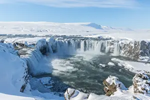 Gooafoss Waterfall in winter with snow and ice