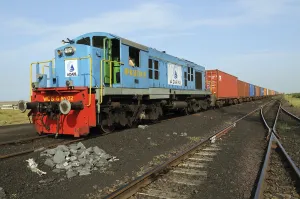 Goods containers with train engine at Adani Power