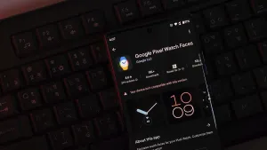 Google Pixel Watch Faces app displayed on a phone screen with a dark-themed keyboard background